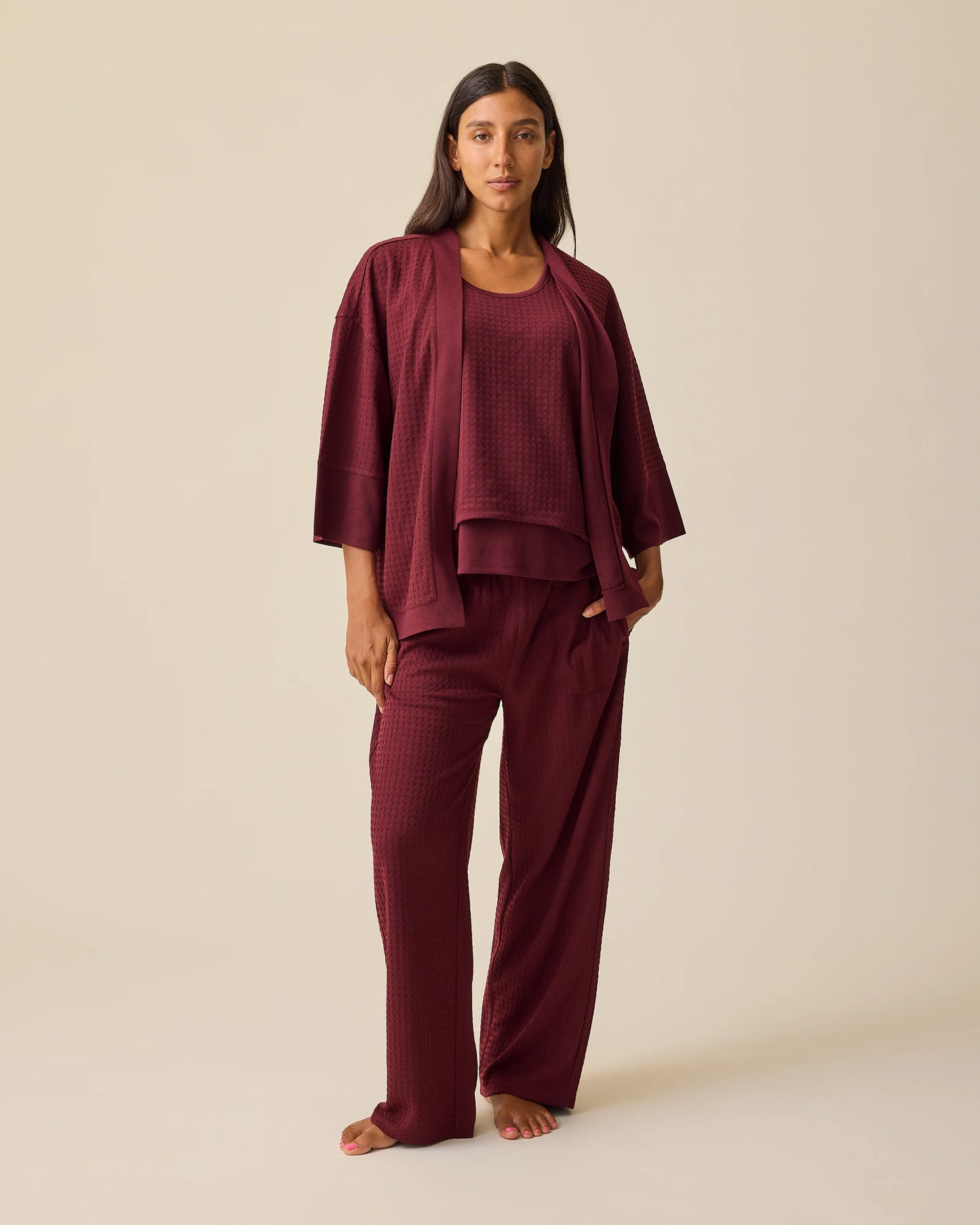 Model is wearing Waffle Maternity & Nursing Three-Piece Lounge Set in Garnet on a beige background. @model_info:Hayley is 5'7" and wearing a Small.