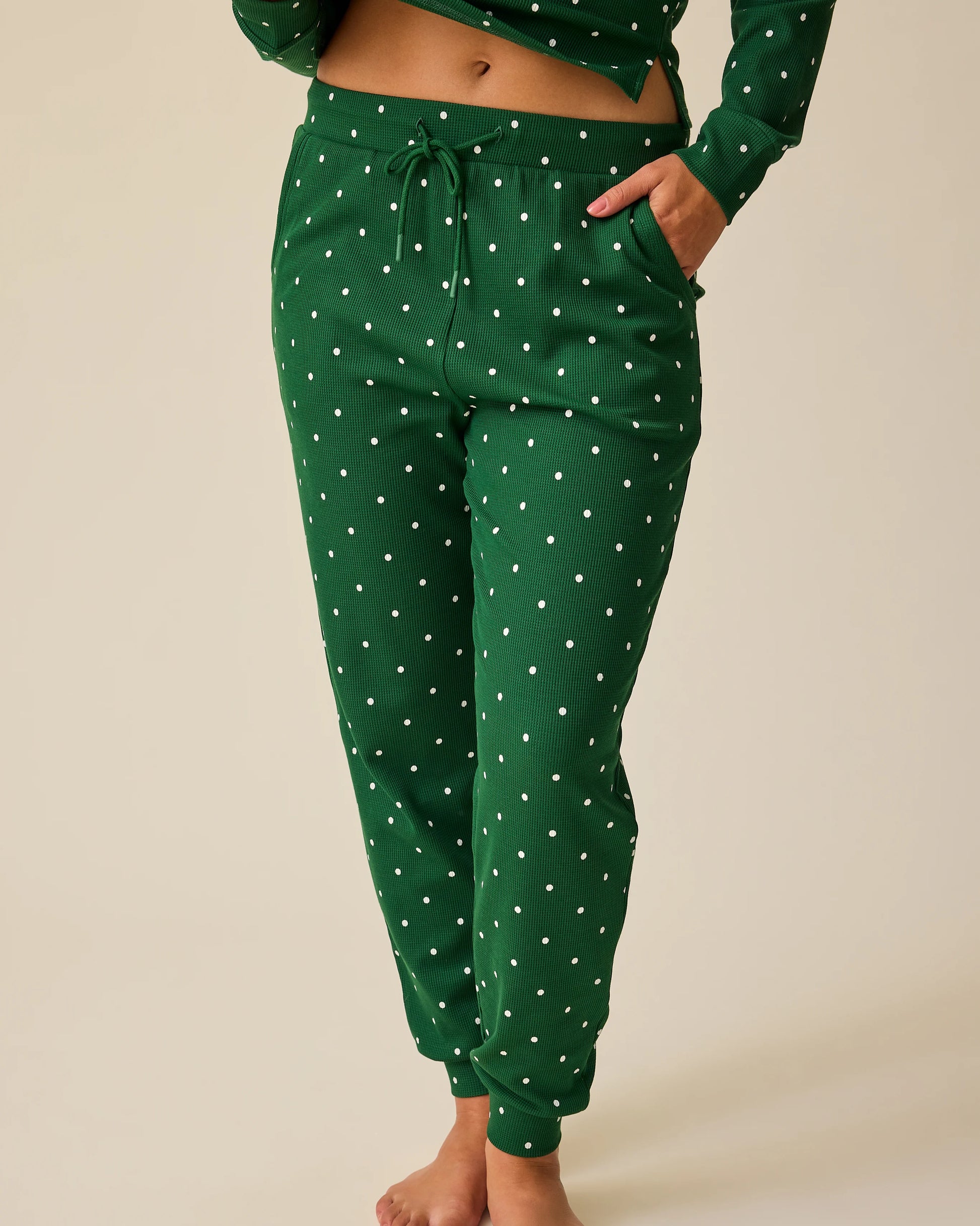 Close up on pants of Waffle Maternity & Nursing Lounge Set in Green Dot on a beige background.