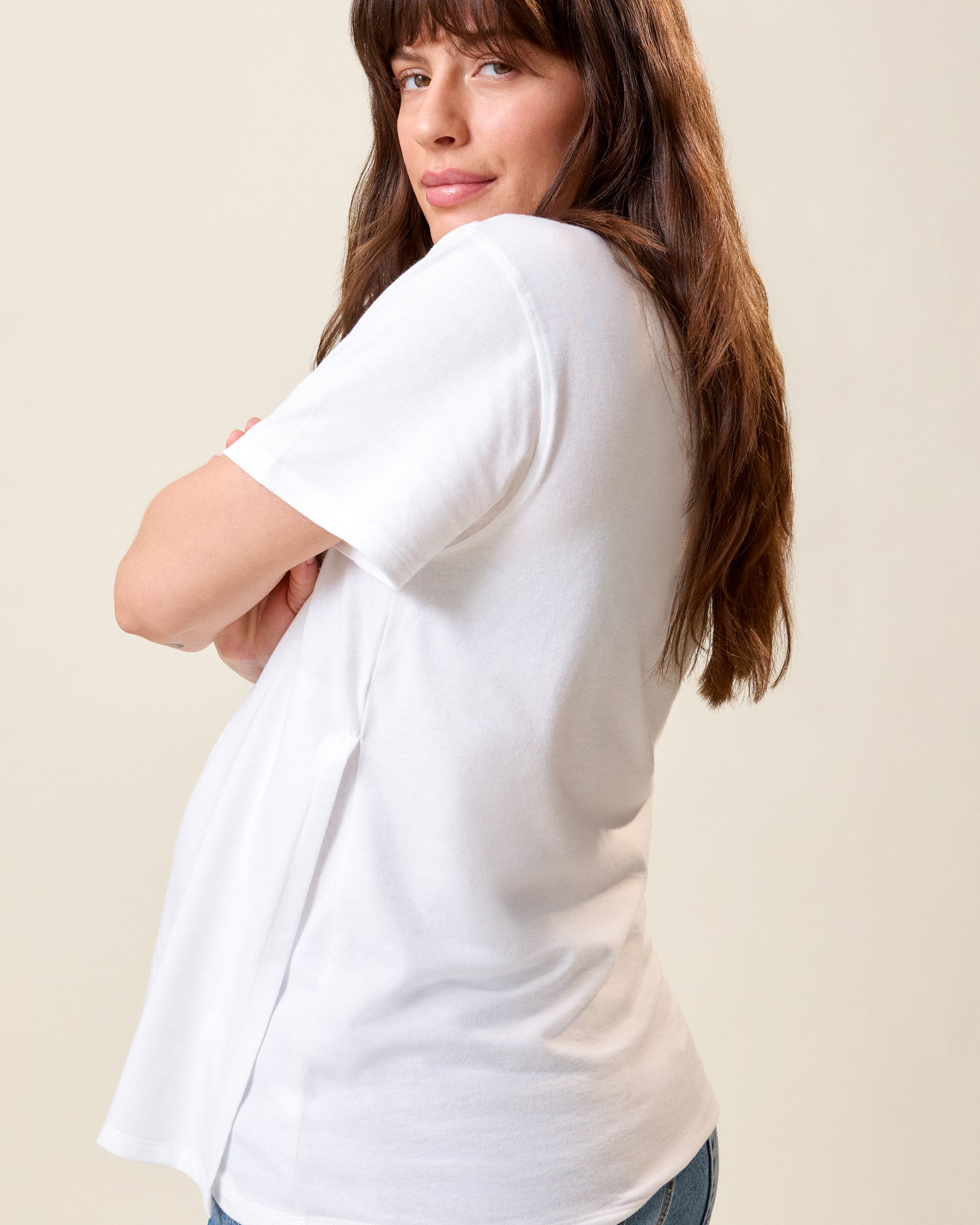 Side view of model wearing Relaxed Cotton Maternity & Nursing T-shirt in White