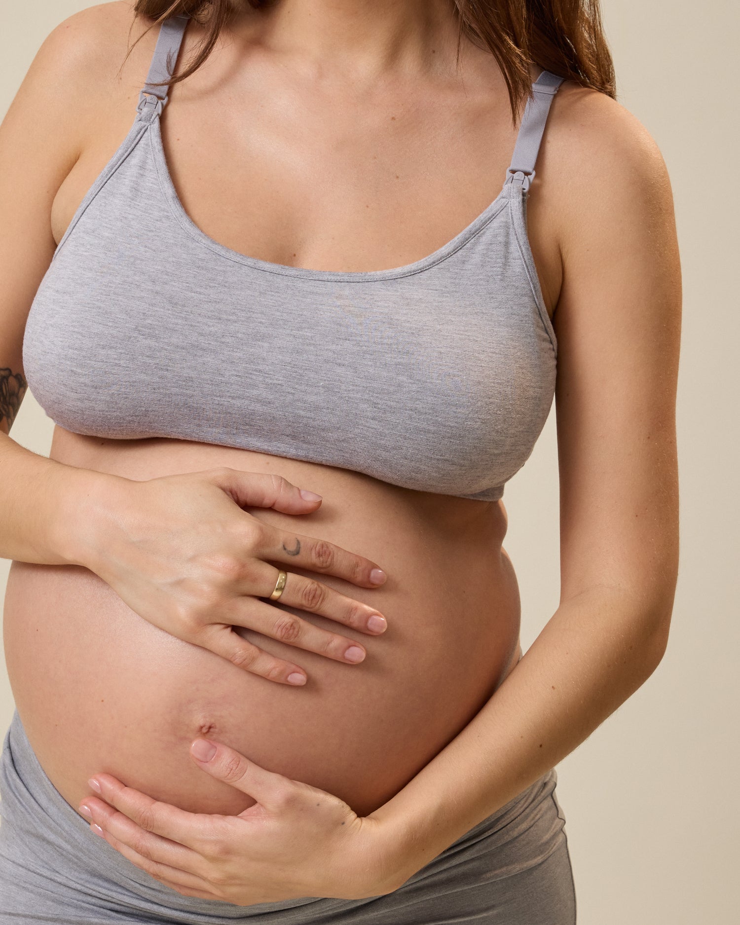 Model wearing French Terry Maternity & Nursing Bralette in Grey Heather against a neutral background@model_info:KJ is wearing a Large.
