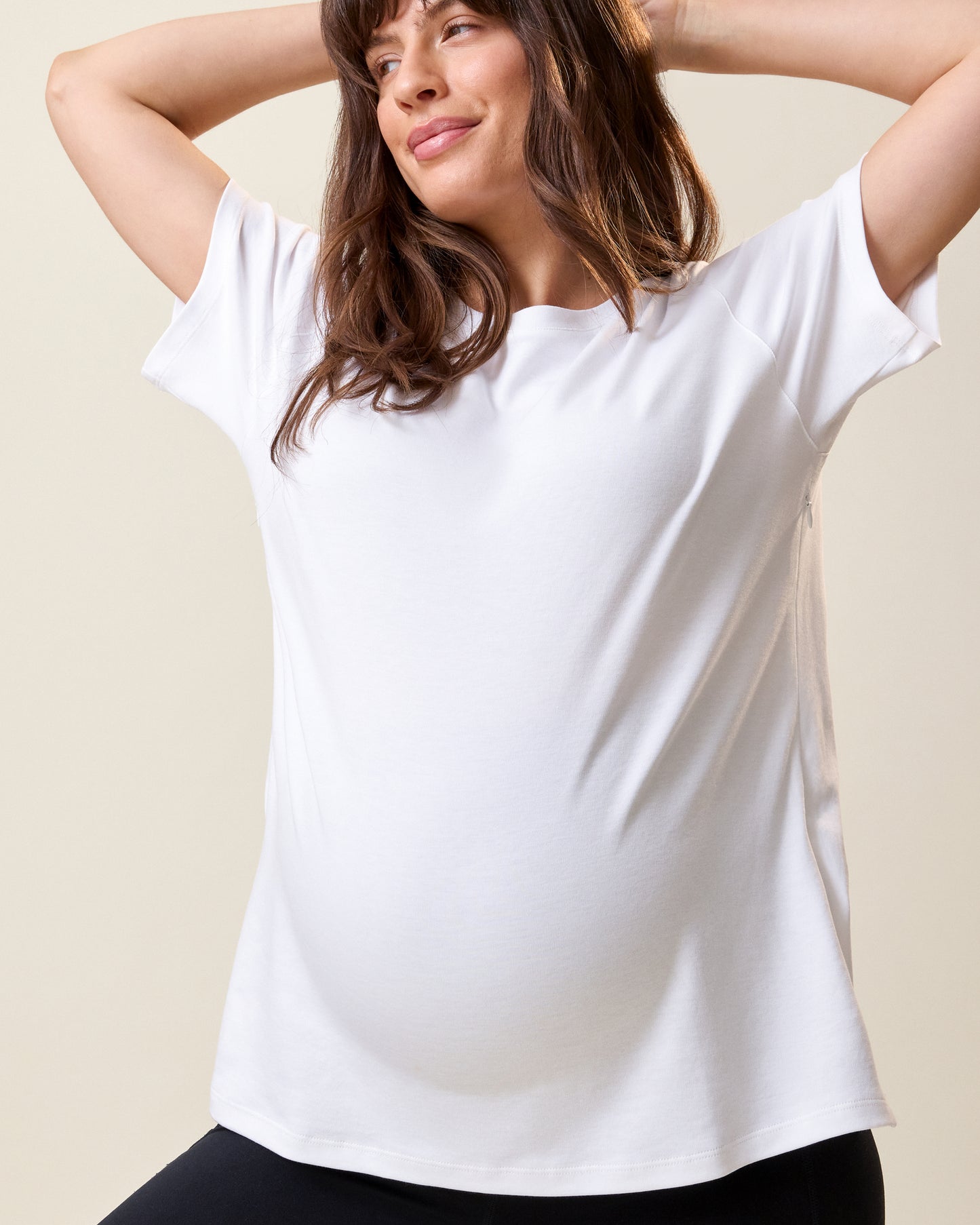 Front view of model wearing Pima Cotton Side Zip Maternity & Nursing T-shirt in White on a neutral background@model_info:KJ is wearing a Medium.