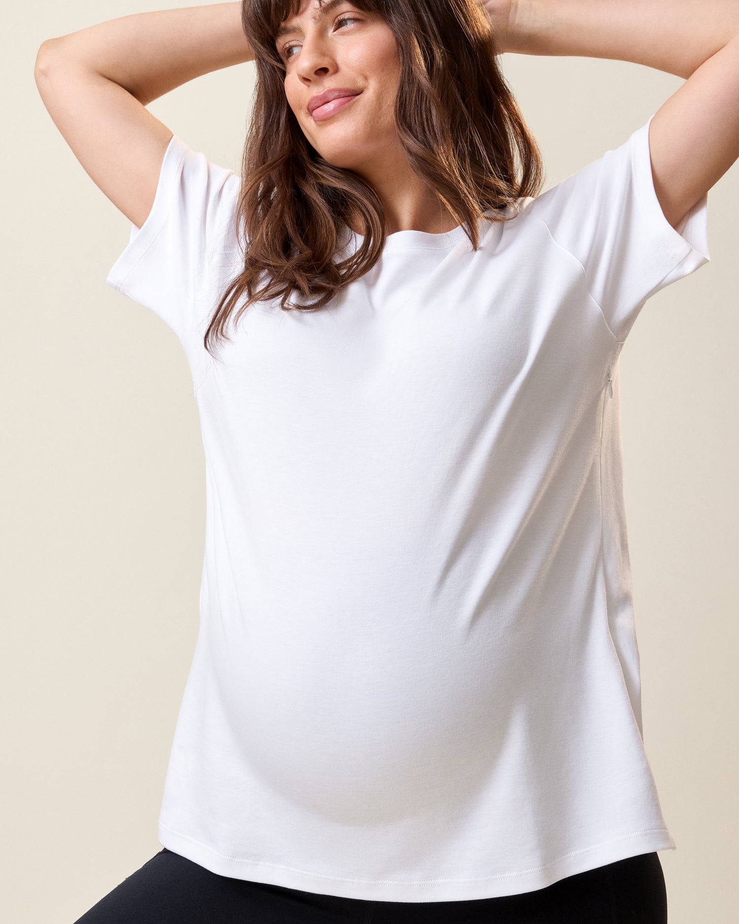Front view of model wearing Pima Cotton Side Zip Maternity & Nursing T-shirt in White on a neutral background@model_info:KJ is wearing a Medium.