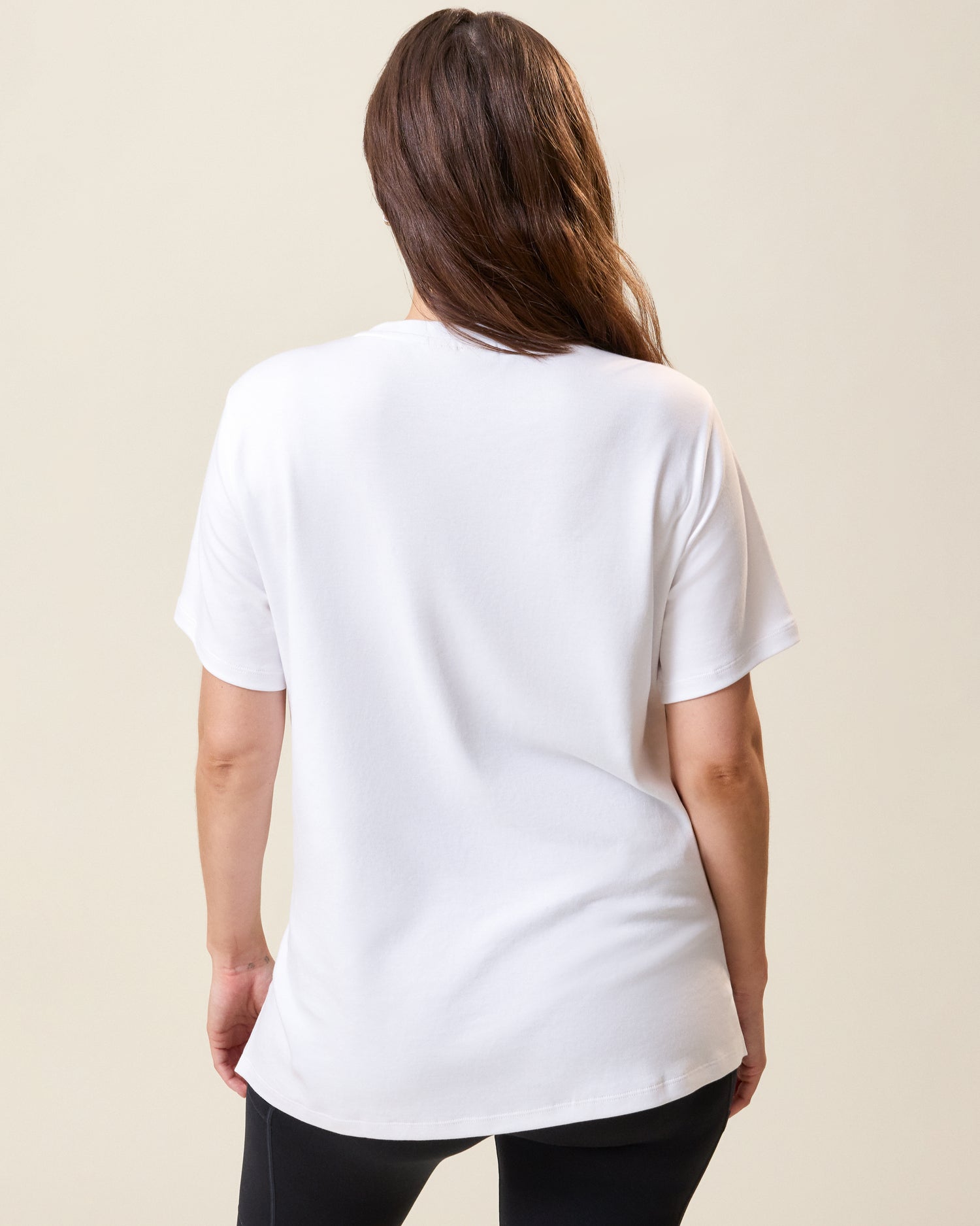 Back view of model wearing Pima Cotton Side Zip Maternity & Nursing T-shirt in White on a neutral background