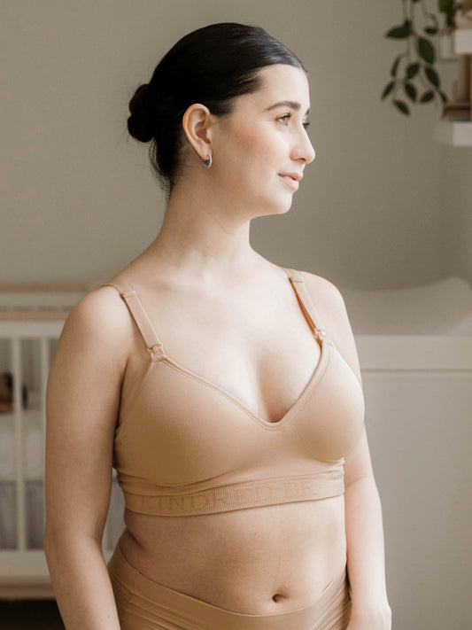 Model wearing the Signature Sublime® Contour Maternity & Nursing Bra in Beige with her hands on her hips. @model_info:Kianna is wearing a Small.