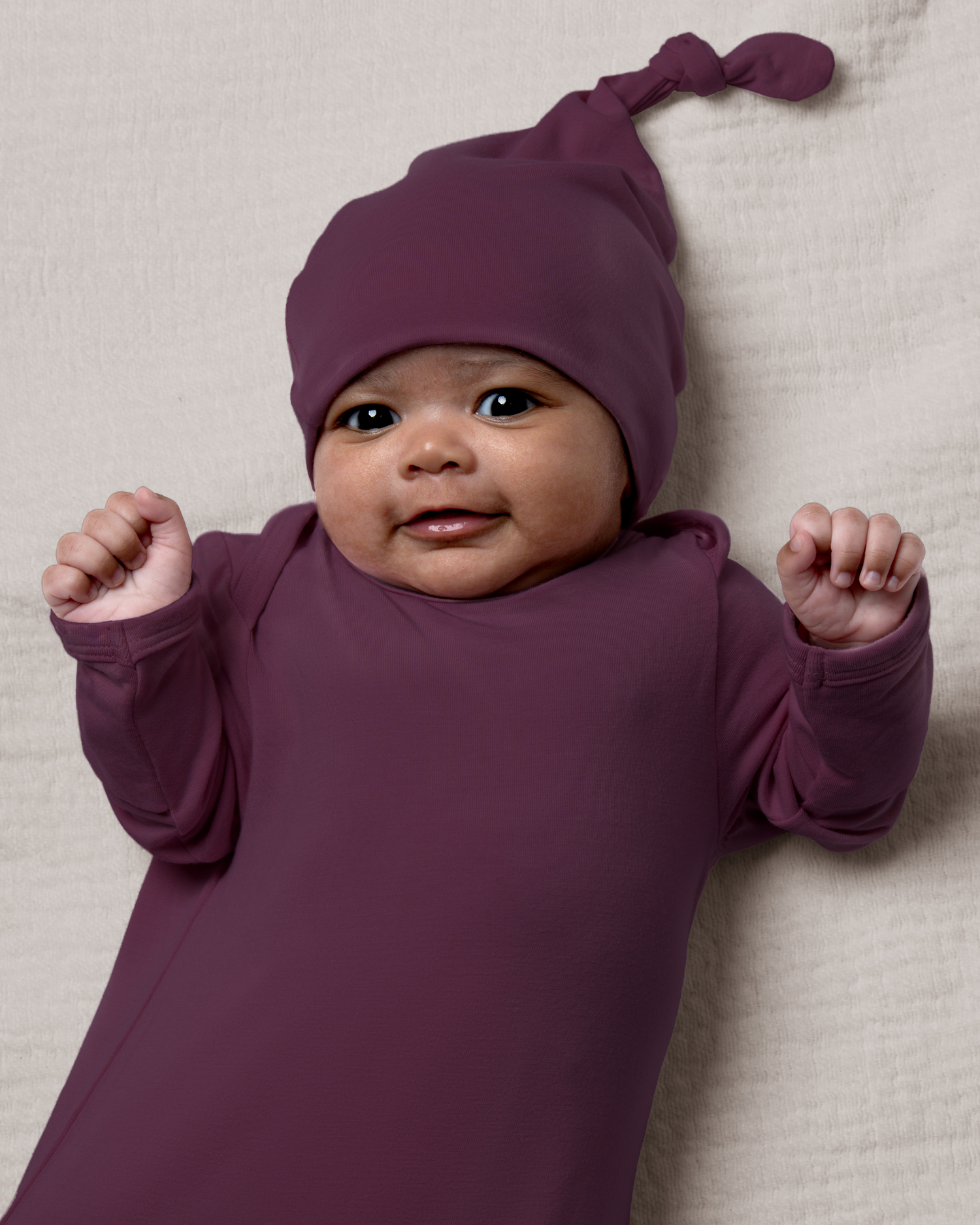 Bamboo Knotted Baby Gown in Burgundy Plum on a neutral background