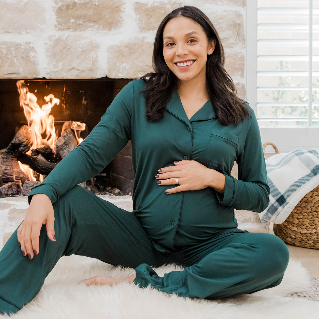 Model wearing the Clea Bamboo Long Sleeve Pajama Set in Evergreen holding her baby bump. @model_info:Julana is wearing a Small.