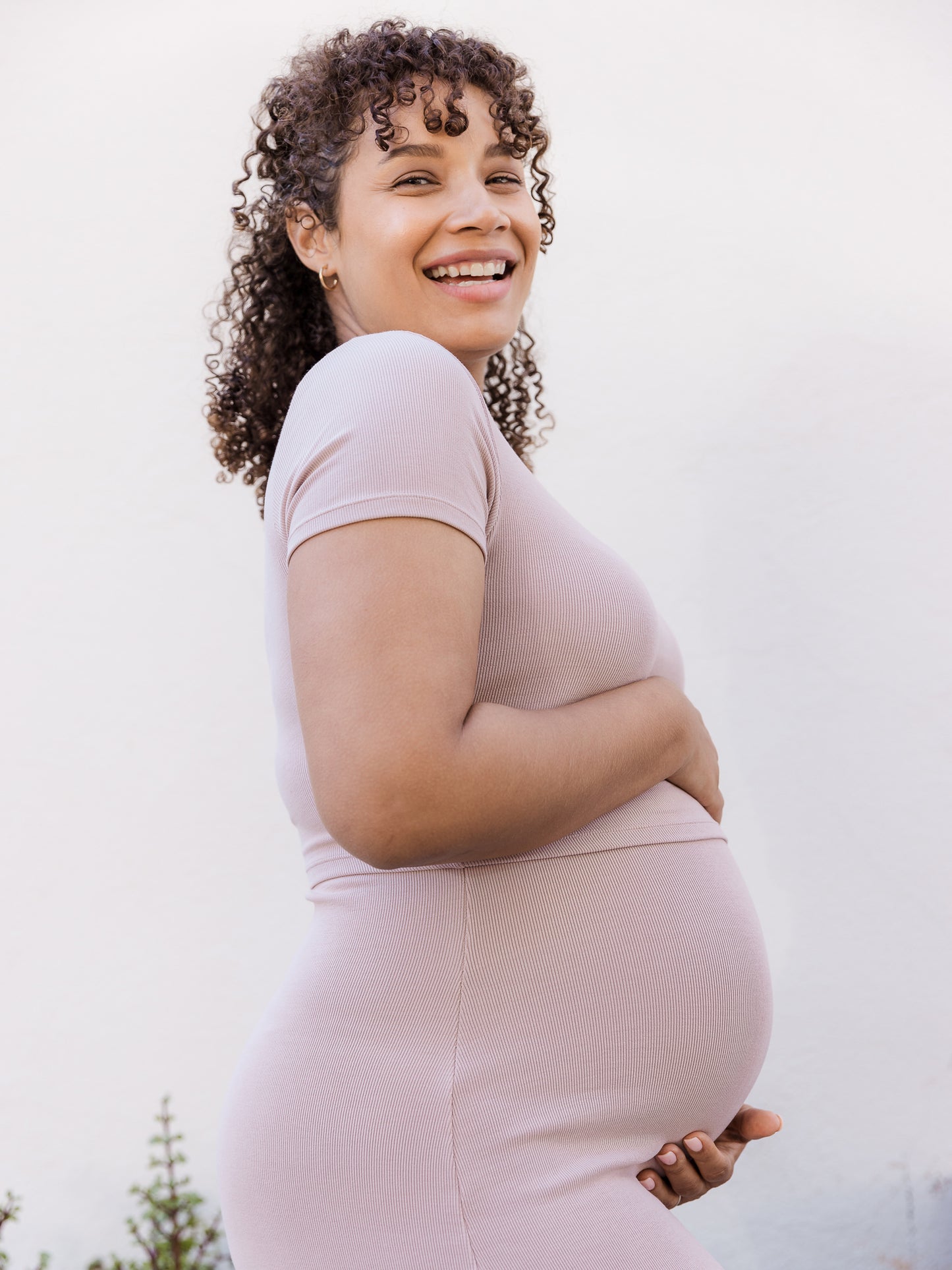 Pregnant model wearing the Olivia Ribbed Bamboo 2-in-1 Maternity & Nursing Dress in Lilac Stone