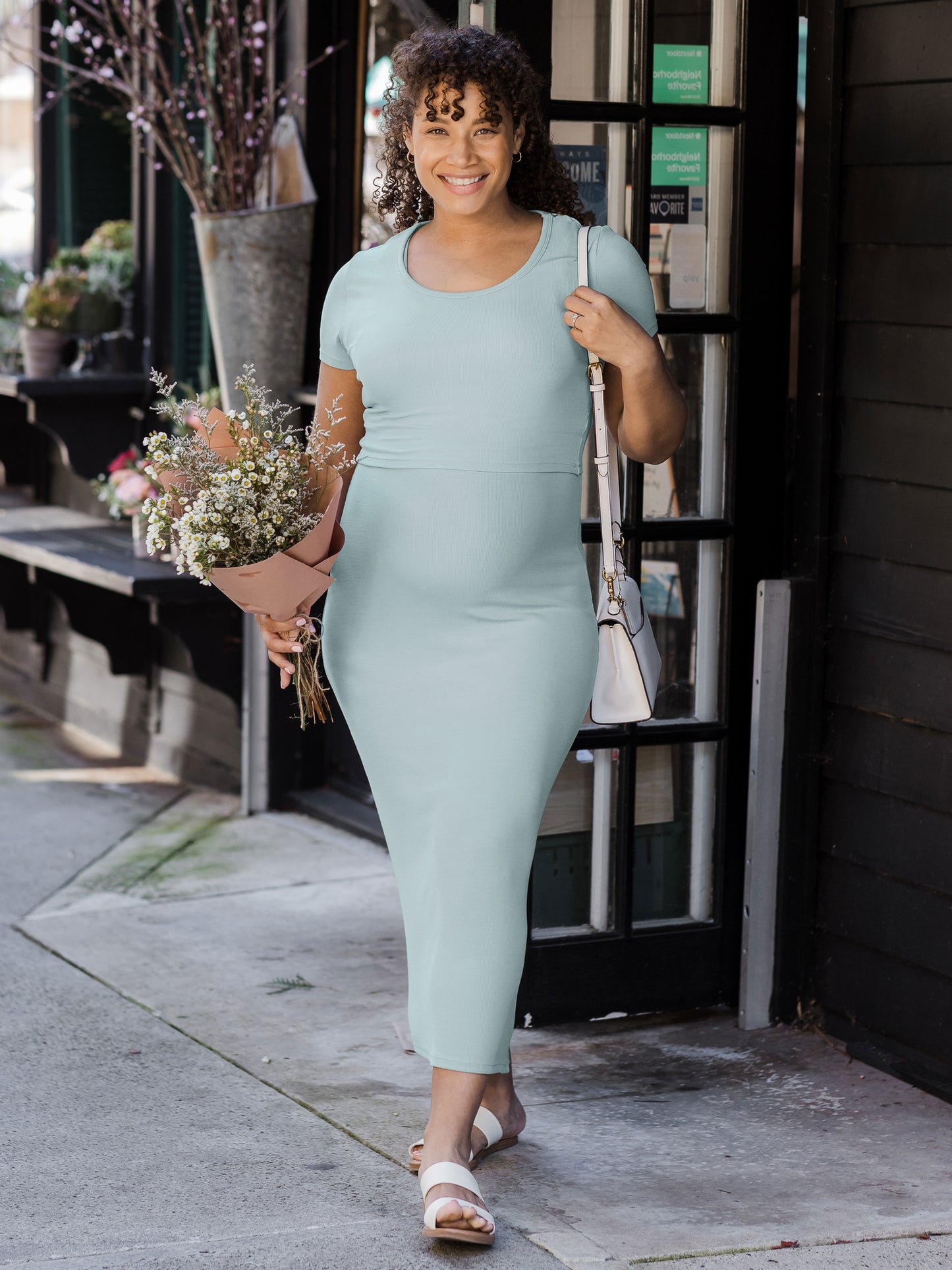 Model is wearing the Olivia Ribbed Bamboo 2-in-1 Maternity & Nursing Dress in Dusty Blue Green. @model_info:Alysha is 5'6" and wearing a Large.