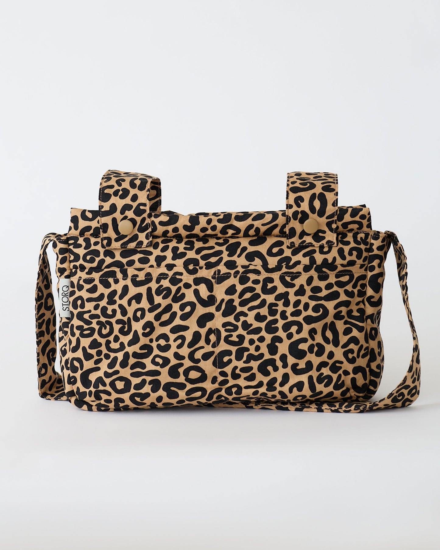 The Stroller Party™ Caddy Bag in Leopard on a beige background.