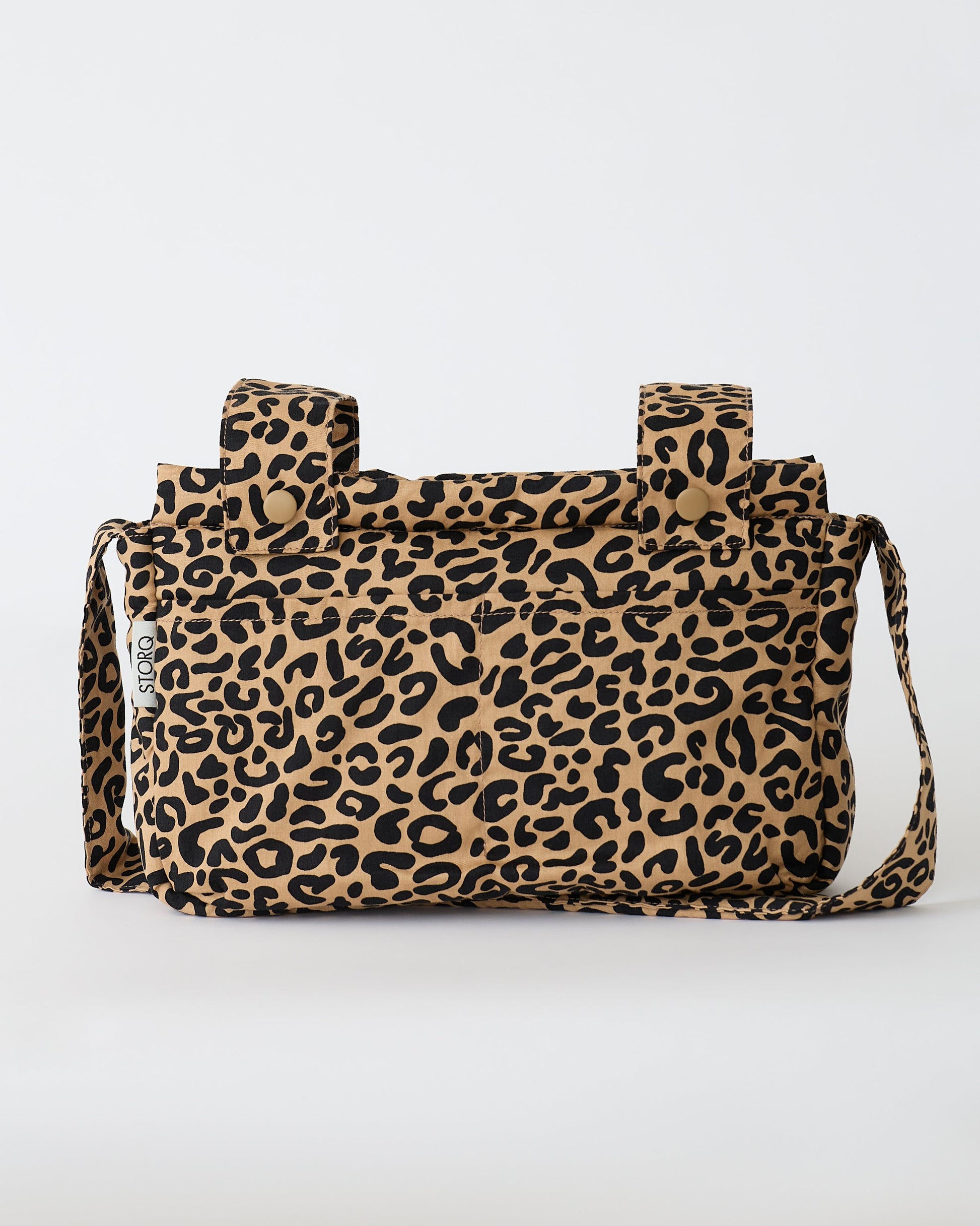 The Stroller Party™ Caddy Bag in Leopard on a beige background.