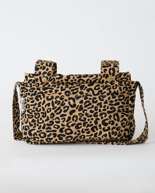 The Stroller Party™ Caddy Bag in Leopard on a beige background.