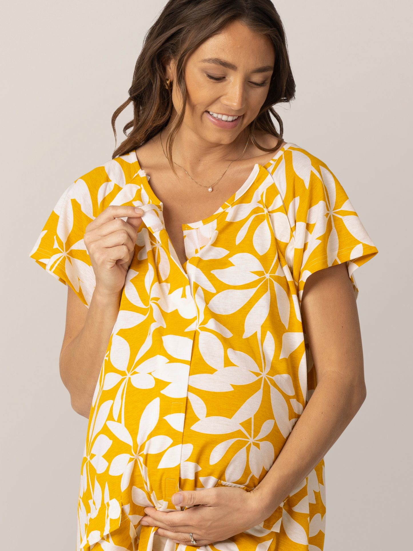 Detail view of front/middle velcro opening on the Universal Labor & Delivery Gown in Honey Leaf, on model