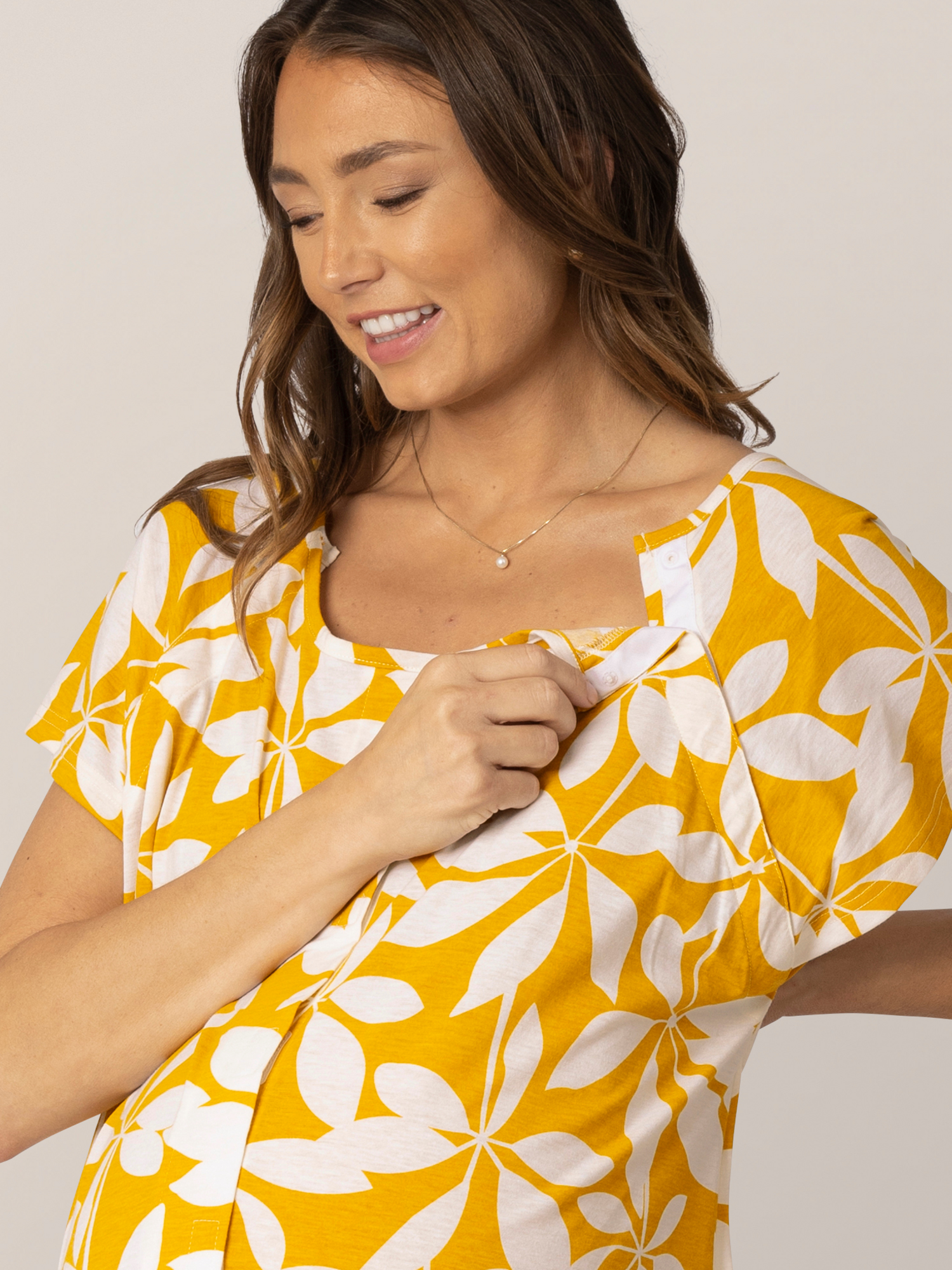 Detail view of front/side velcro opening on the Universal Labor & Delivery Gown in Honey Leaf, on model