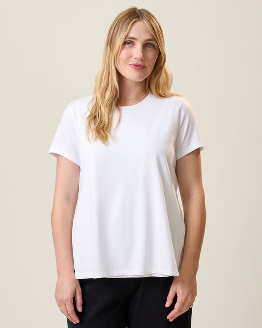 Front view of model wearing Classic Cotton Nursing T-shirt in White on a neutral background@model_info:Lauren is wearing a Medium.