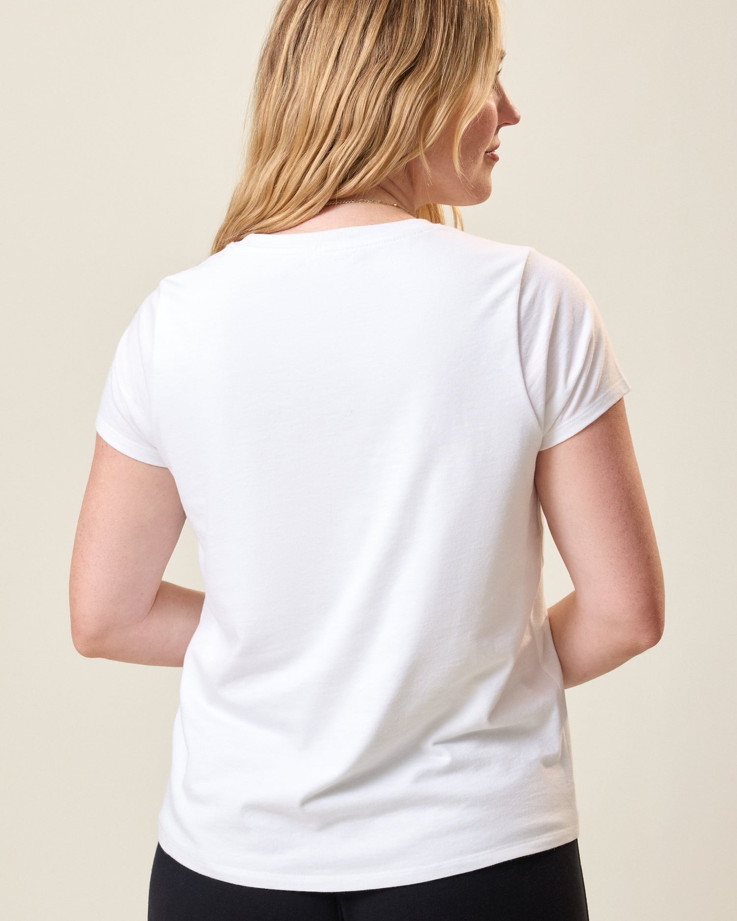 Back view of model wearing Slim Fit Cotton Nursing T-shirt in White on a neutral background