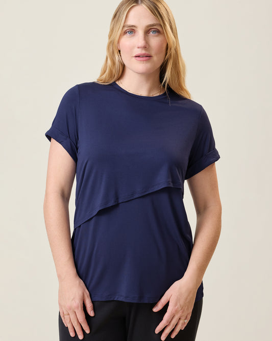 Front view of model wearing the Asymmetrical Nursing T-shirt in Navy@model_info:Lauren is wearing a Medium.