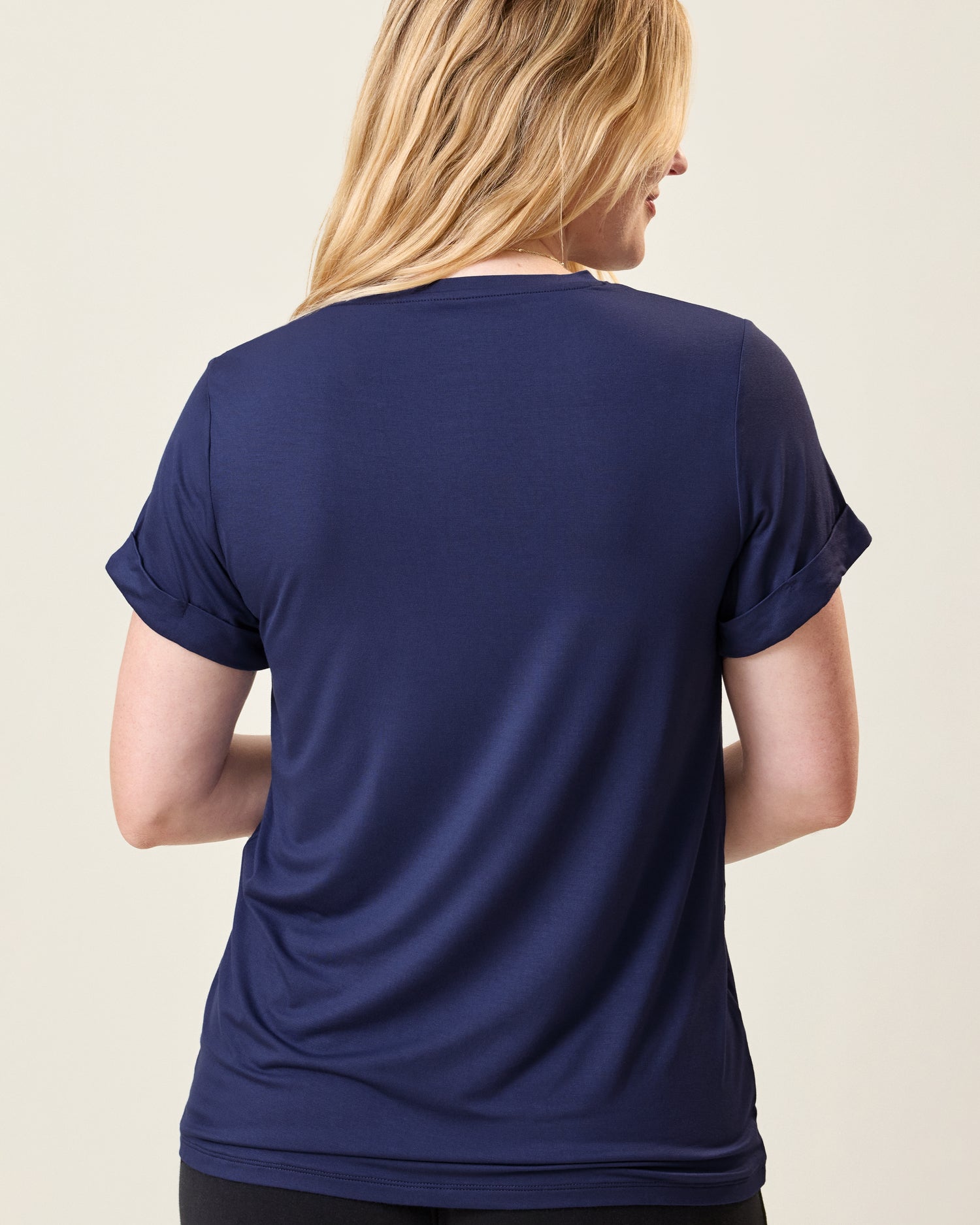 Back view of model wearing the Asymmetrical Nursing T-shirt in Navy