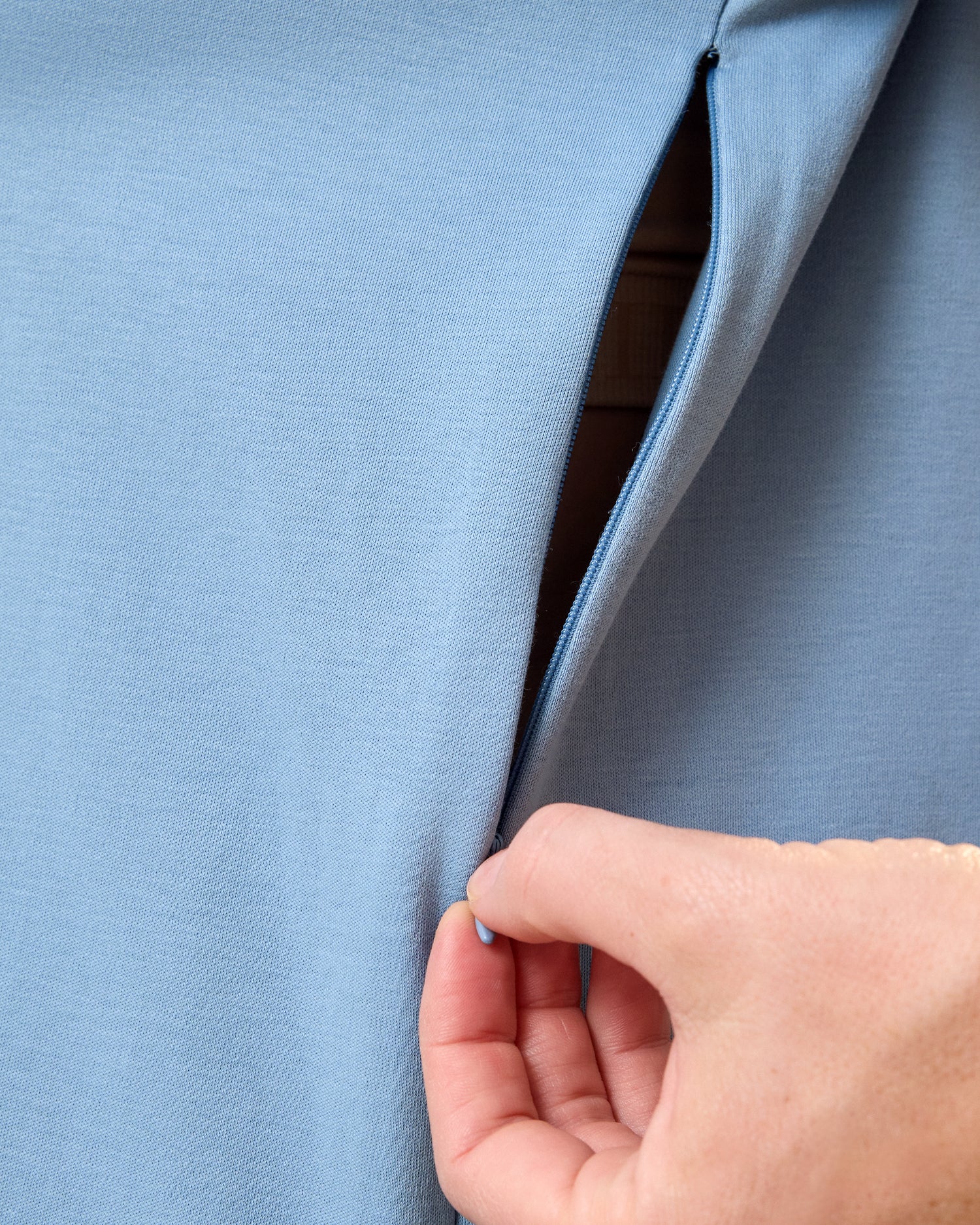 Close of model wearing Pima Cotton Side Zip Maternity & Nursing T-shirt in Vintage Blue showing the side zip