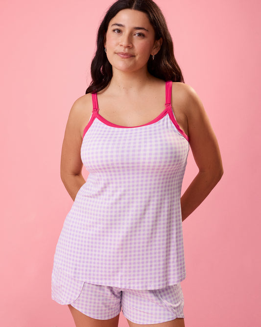Front view of model wearing Bamboo Lounge Around Nursing Tank in Lavender Gingham on a pink background@model_info:Linda is wearing a Small.
