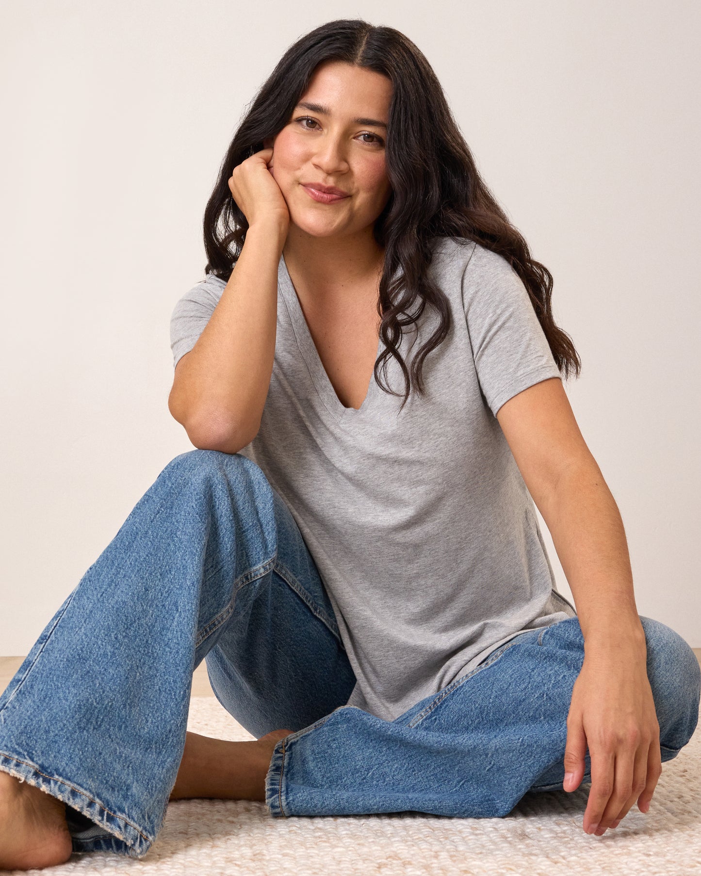 Model wearing Classic Modal V-neck Nursing T-shirt in Grey Heather sitting on the floor in a relaxed pose