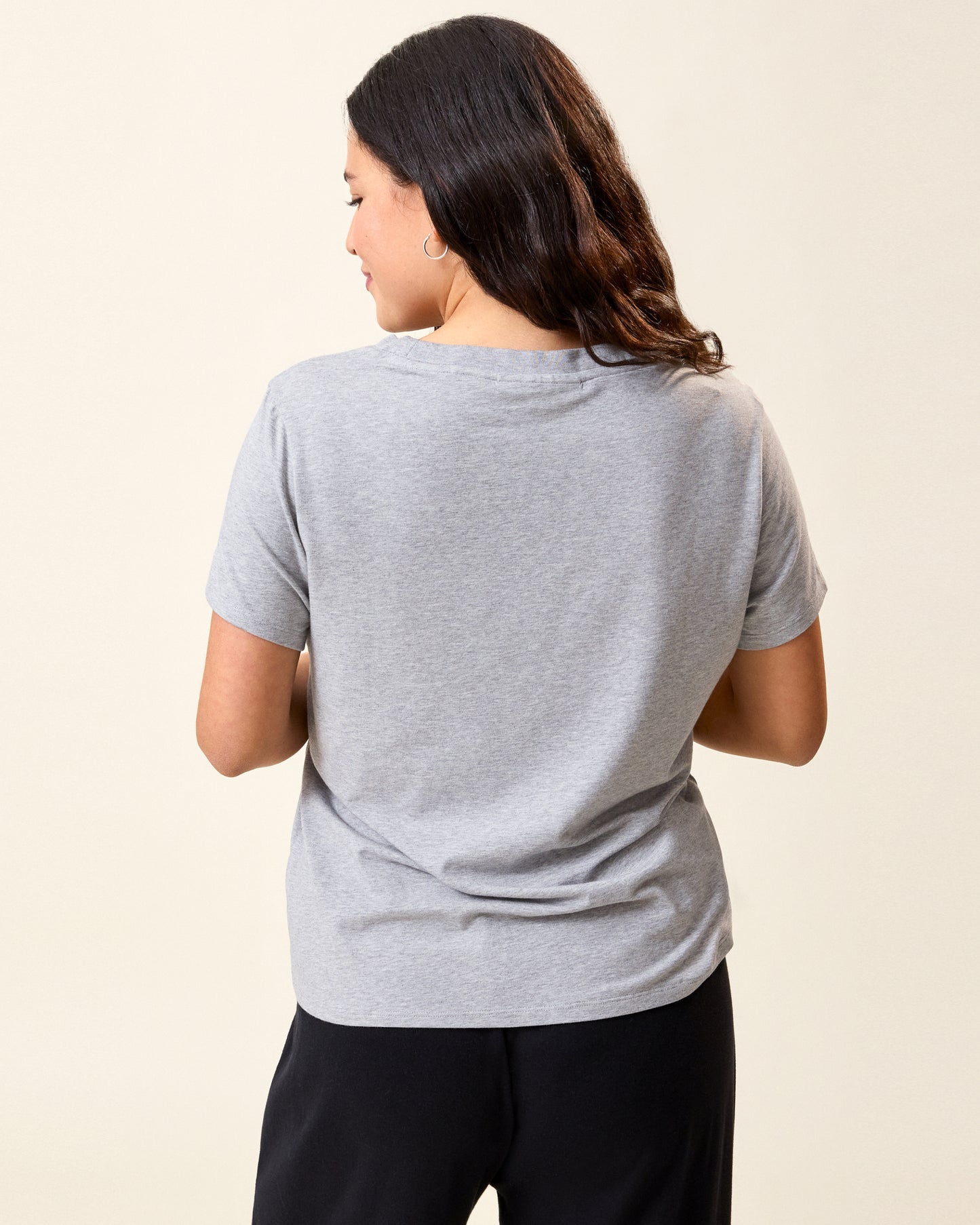 Back view of model wearing Classic Modal V-neck Nursing T-shirt in Grey Heather on a neutral background