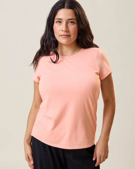Front view of model wearing the Slim Fit Modal Nursing T-shirt in Sunset Pink@model_info:Linda is wearing a Small.