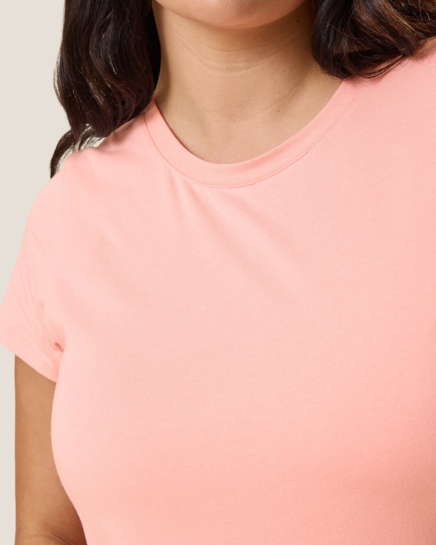 Close up of model wearing the Slim Fit Modal Nursing T-shirt in Sunset Pink showing the neckline