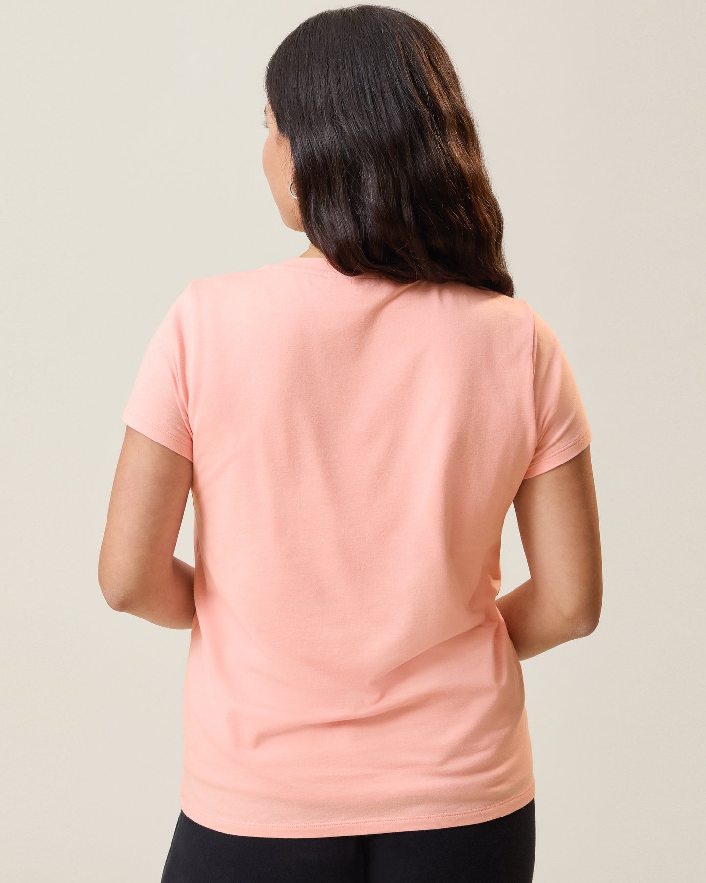 Back view of model wearing the Slim Fit Modal Nursing T-shirt in Sunset Pink