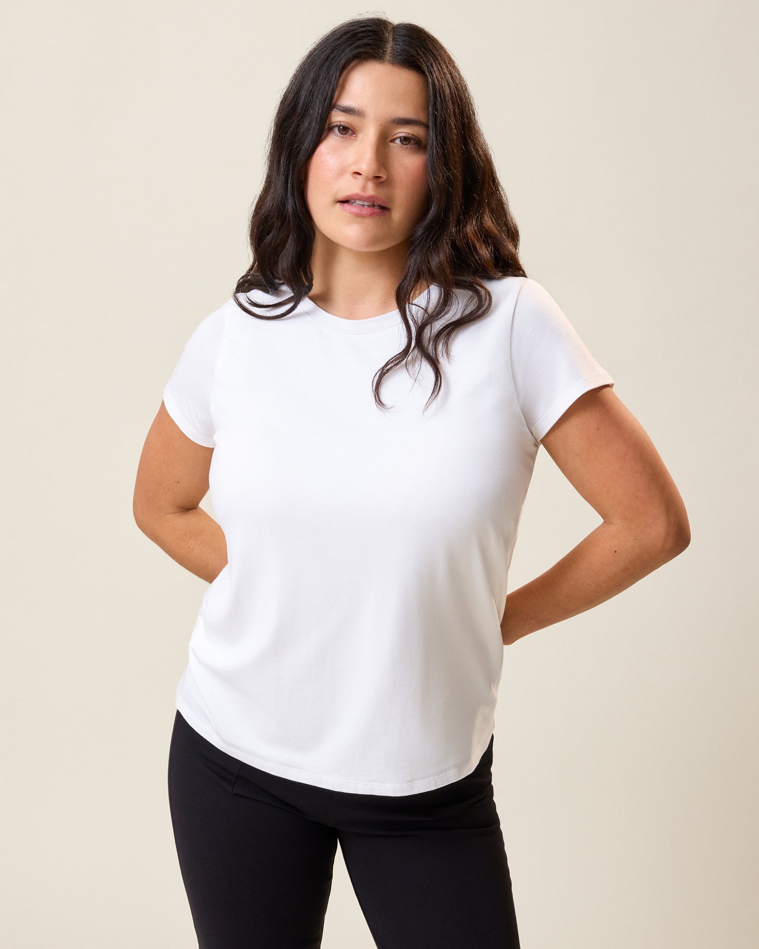 Front view of model wearing Slim Fit Modal Nursing T-shirt in White on a neutral background@model_info:Linda is wearing a Small.