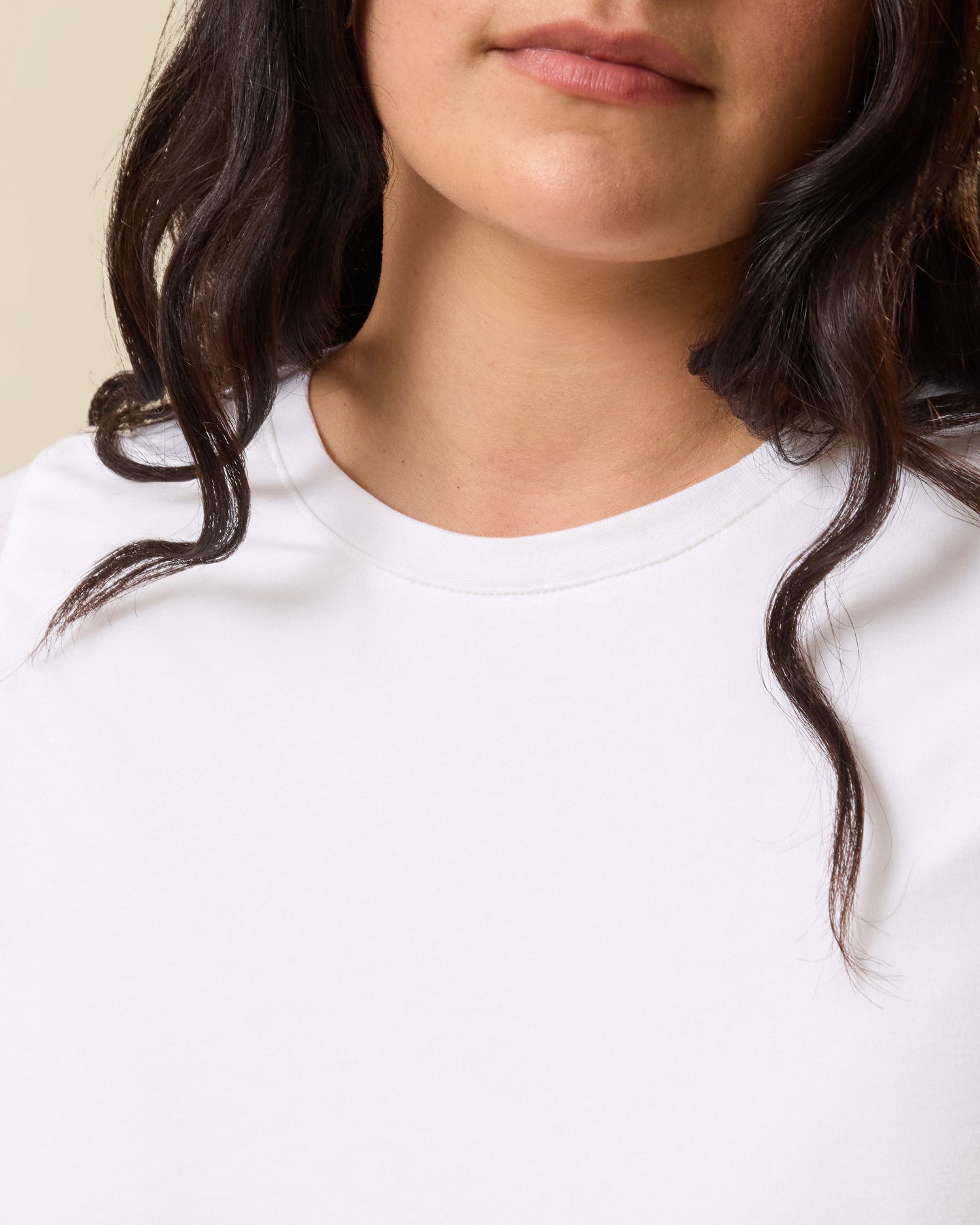 Close up of model wearing Slim Fit Modal Nursing T-shirt in White showing the detail of the neckline