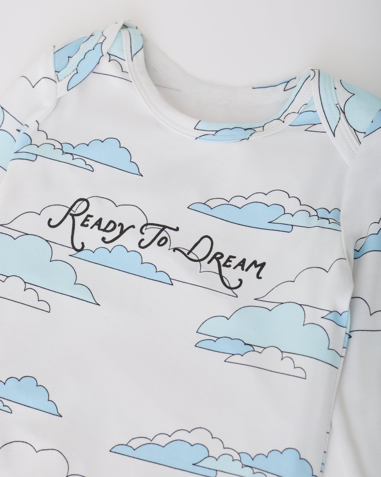Close up of collar on White Clouds of Long Sleeve Bamboo Onesie Two-Pack in Clouds on a white background.