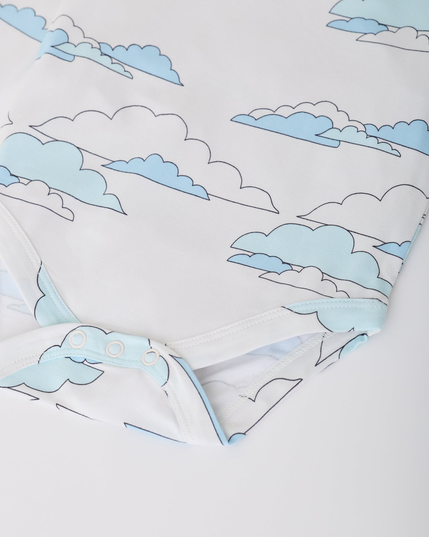 Close up of snaps on White Clouds of Long Sleeve Bamboo Onesie Two-Pack in Clouds on a white background.