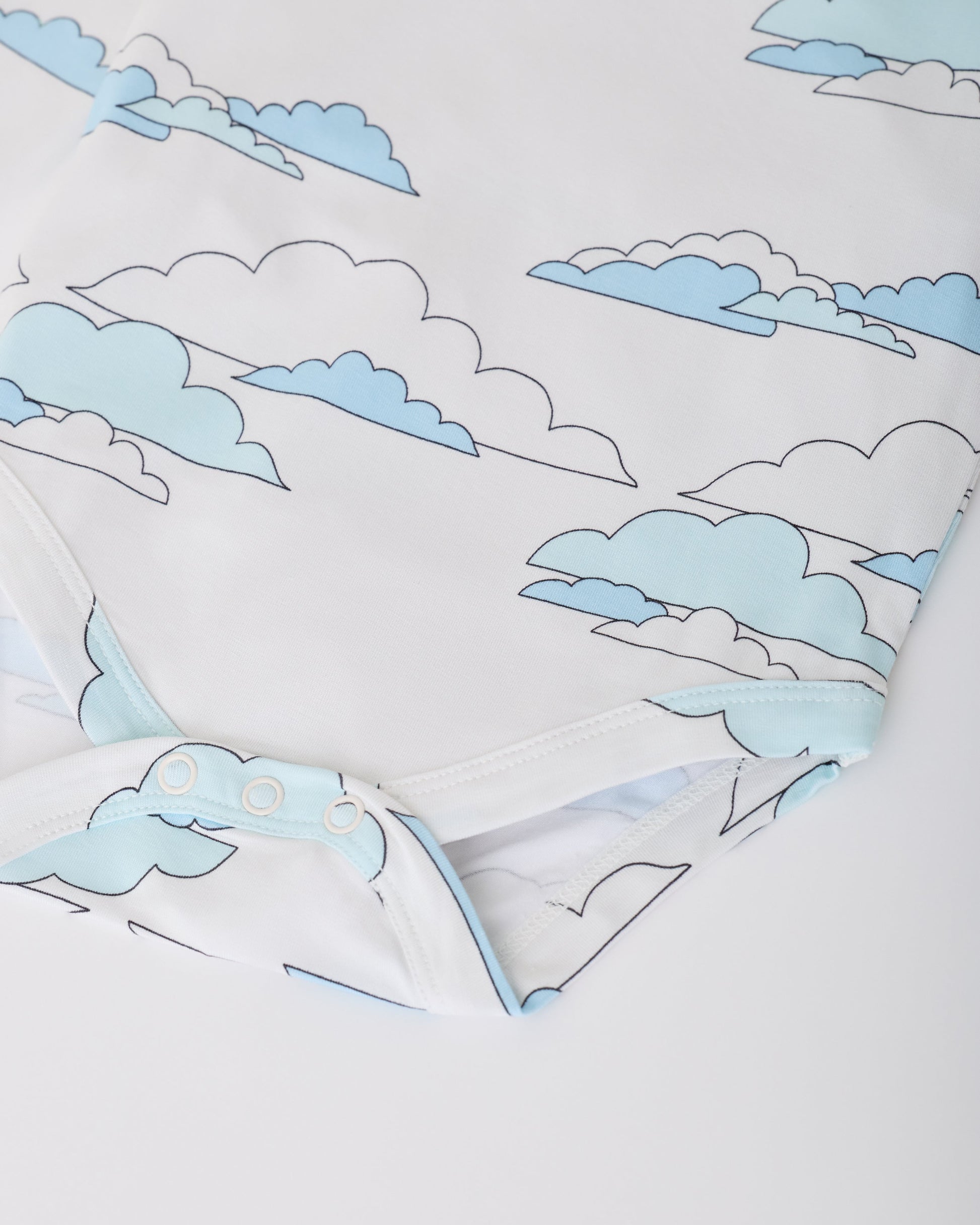 Close up of snaps on White Clouds of Long Sleeve Bamboo Onesie Two-Pack in Clouds on a white background.