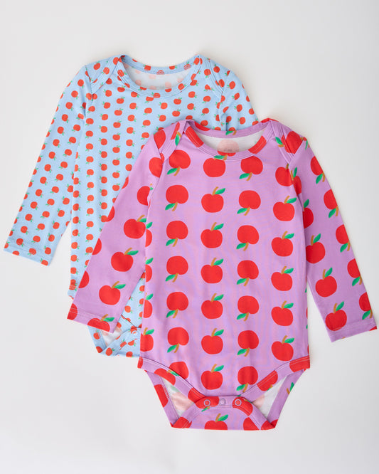 Long Sleeve Bamboo Onesie Two-Pack in Apple pattern on a gray background.