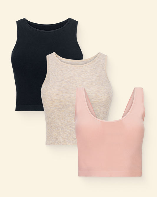 Three longline bra tops in black, oatmeal, and pink on a light beige background