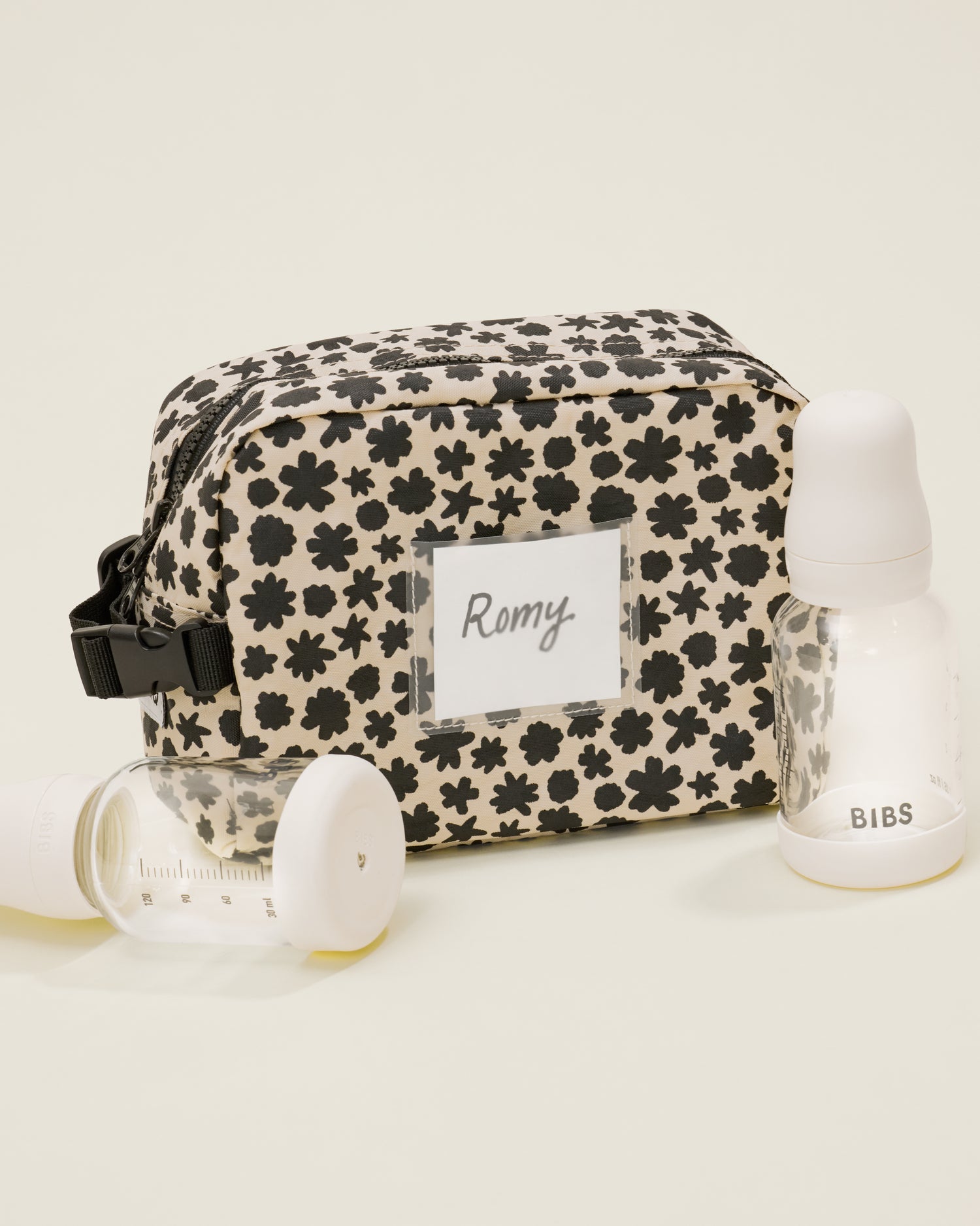 Mini Cooler Bag in the Cream Chamomiles print with a name tag 