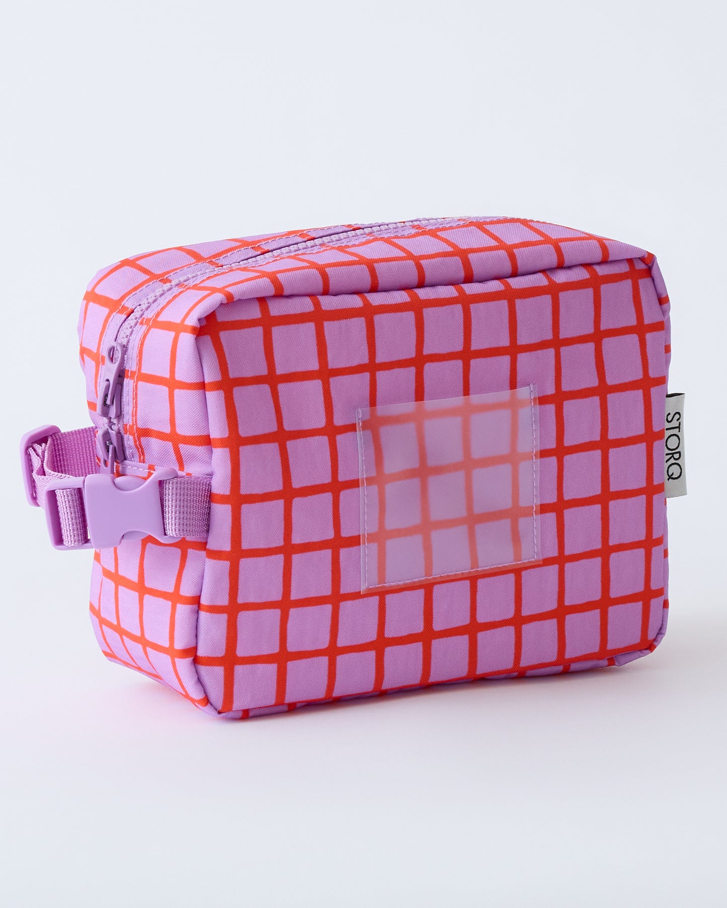 Mini Cooler Bag in Orchid Grid, on a beige background.