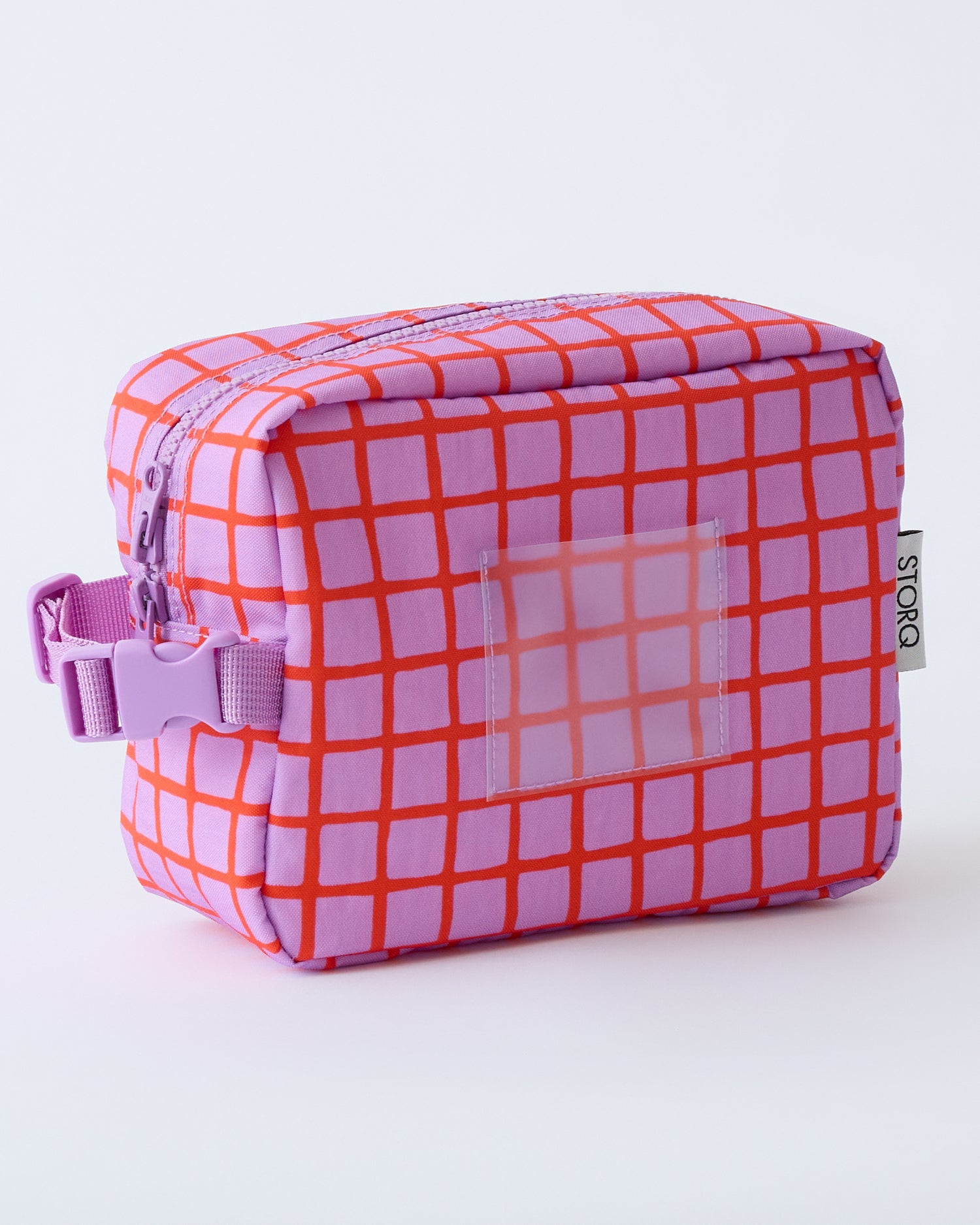 Mini Cooler Bag in Orchid Grid, on a beige background.