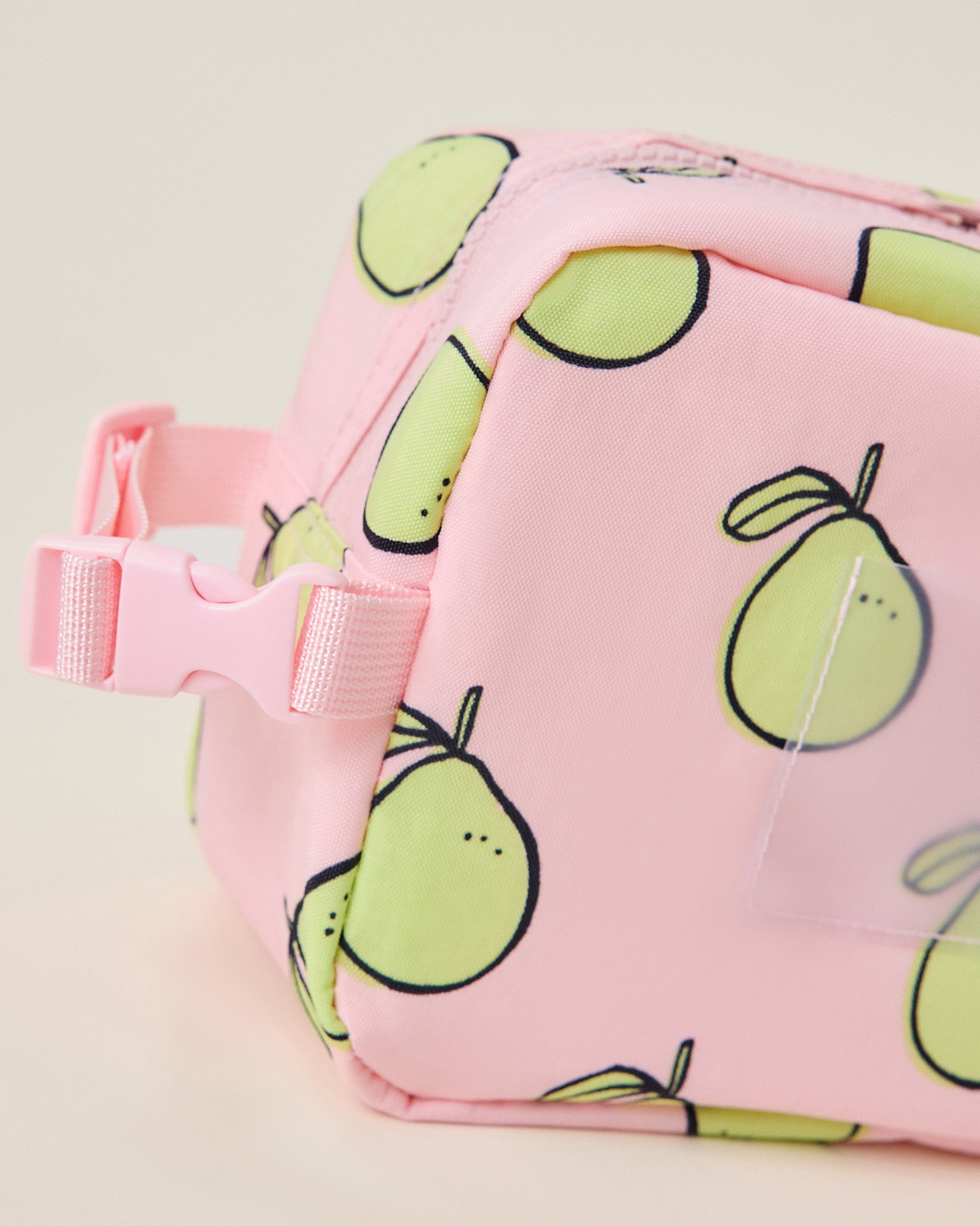 Pink Mini Cooler Bag with green pomelo pattern on a light pink background