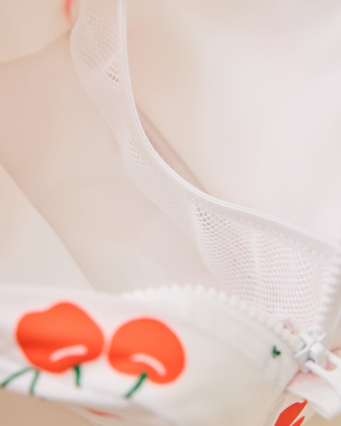 Close-up of inside a white Mini Cooler Bag with red cherry pattern
