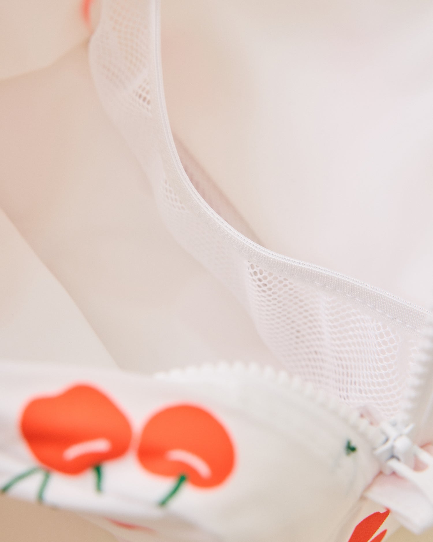 Close-up of inside a white Mini Cooler Bag with red cherry pattern