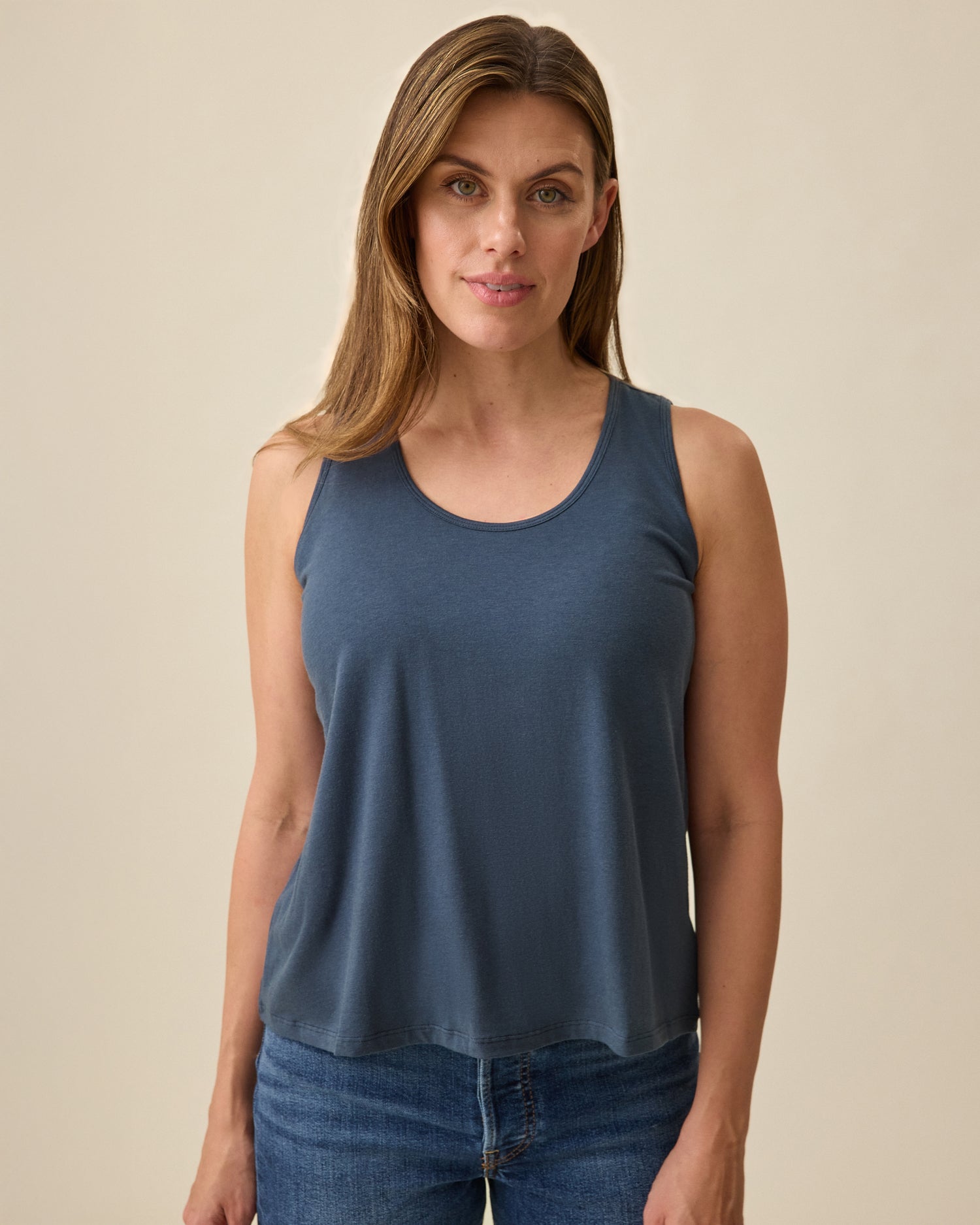 Model is wearing Modal Signature Nursing Tank in Midnight Blue on a beige background @model_info:Brittany is wearing a Small.