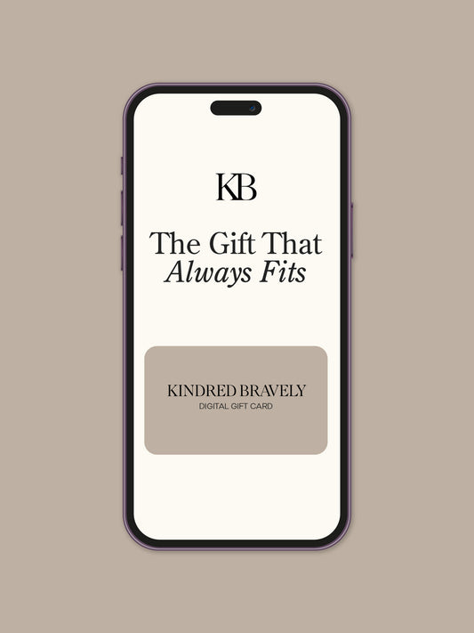 Phone screen displaying 'KB The Gift That Always Fits' with Kindred Bravely branding on a beige background