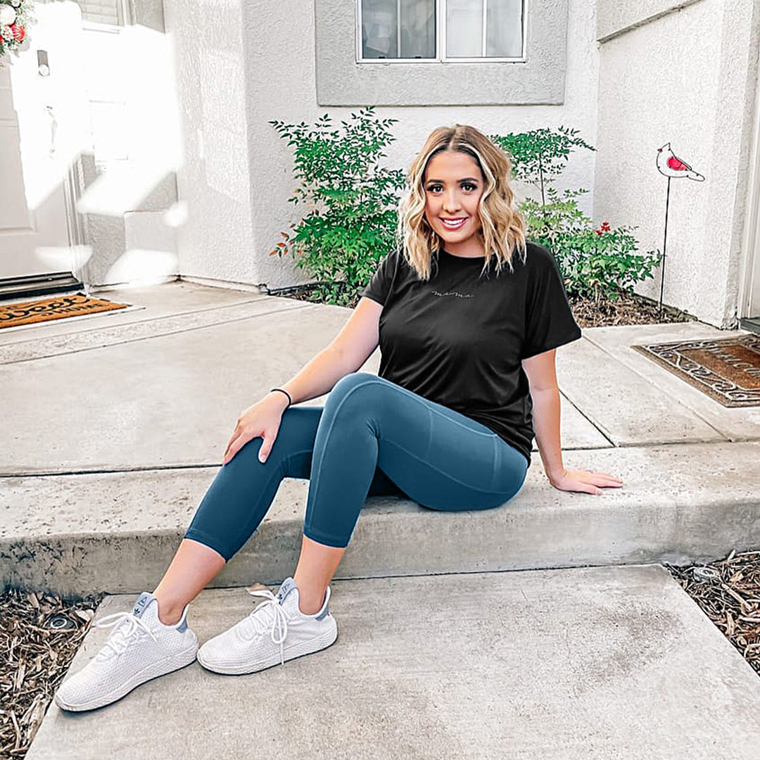 Model wearing the Martina Maternity & Postpartum Crop Legging | Storm Sitting on a stair. @model_info:Cheyanne is wearing a Large.