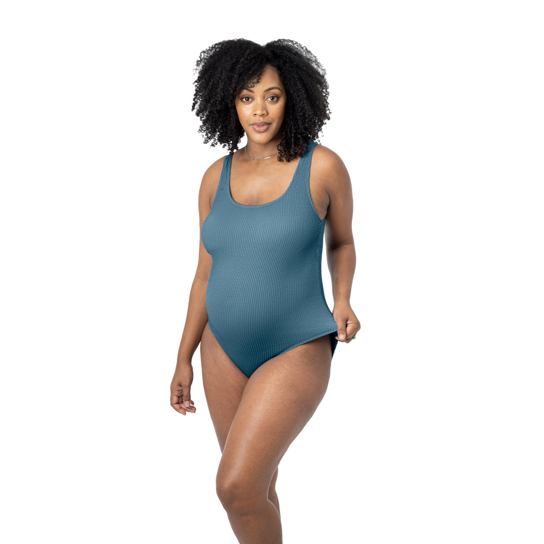 Pregnant model wearing the Crinkle Maternity One Piece Swimsuit @model_info:Roxanne is wearing a Large.