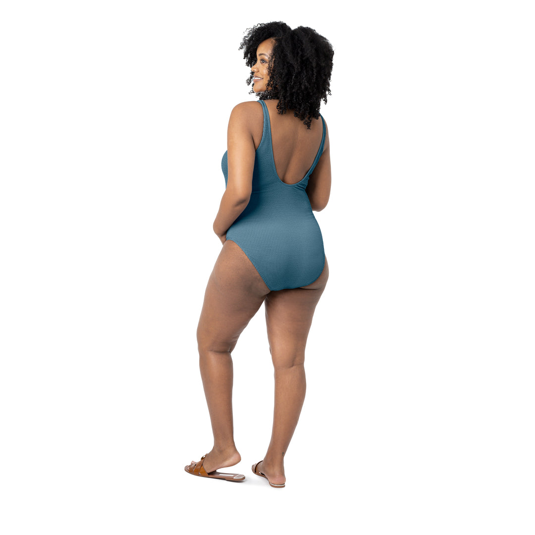Back view of a model wearing the Crinkle Maternity One Piece Swimsuit