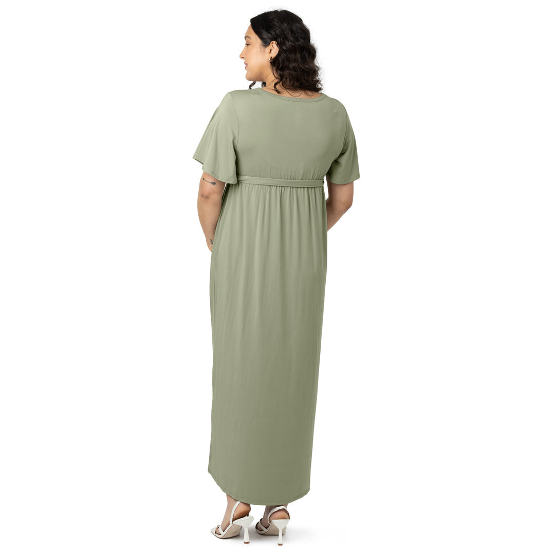 Back view of a model wearing the Wrap Maternity Maxi Dress in Rosemary.