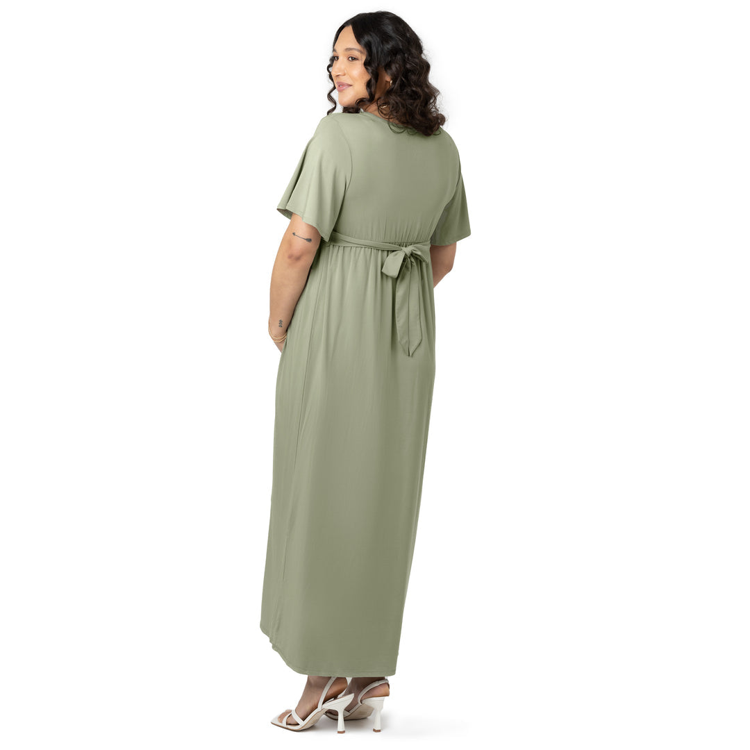 Back view of a pregnant model wearing the Wrap Maternity Maxi Dress in Rosemary.