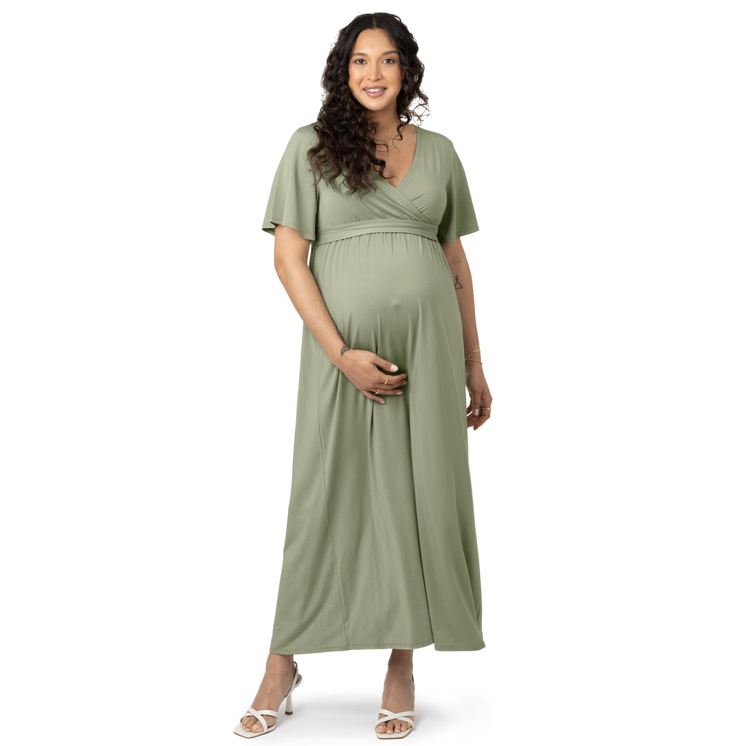 Front view of a pregnant model wearing the Wrap Maternity Maxi Dress in Rosemary.