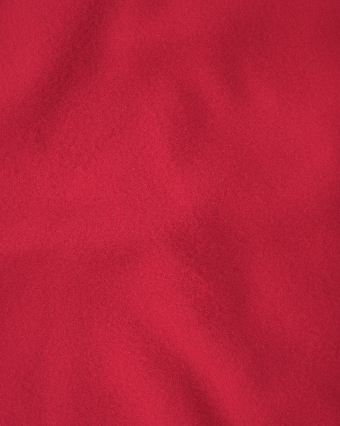 Close up of the red blanket on the Nap Mat in Blue Cherries pattern.